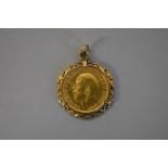 A George V 1922 gold sovereign, in a gold pendant mount hallmarked 9ct, 11.4g total weight.