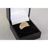 A baguette and brilliant cut diamond set gold ring, hallmarked 9ct ring, 1ct approximately, 4.6g