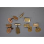 Three pairs of engine turned gold cufflinks, hallmarked 375, 12.5g.