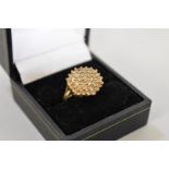 A diamond cluster gold ring, hallmarked 9ct, 0.5ct approximately, 4.4g total weight.