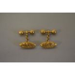 A pair of vintage oval chased gold cufflinks, stamped '18', 8.2g.