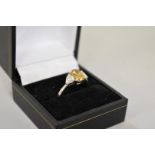 A yellow and white diamond three stone platinum ring, hallmarked .950, central diamond 1.5ct