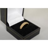 A fancy yellow diamond pave set gold ring, hallmarked 9ct, 0.4ct approximately, 2.7g total weight.