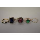 Four gem set gold rings, hallmarked or stamped 9ct, 15g total weight; together with a diamond gold