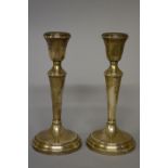 A pair of silver candlesticks, by A Chick & Sons Ltd, Birmingham 1973, 18.5cm high.