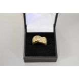 A diamond set wave style gold dress ring, hallmarked 14ct, 1ct approximately, 6g total weight.