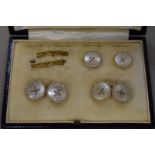 A pair of mother of pearl gold cufflinks, and two matching buttons, stamped 9ct.