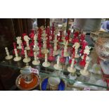 A 19th century English carved ivory Lund pattern chess set, red stained and natural, king 9.5cm,