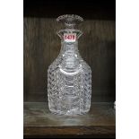 A cut clear glass decanter and stopper, (nibbles to stopper).