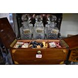 An early 20th century mahogany and inlaid combined tantalus and games box, incorporating a boxwood