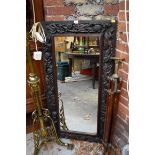 A carved oak framed rectangular wall mirror, 119.5 x 62.5cm.