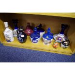 A collection of pottery spirit flasks and decanters, (no contents).