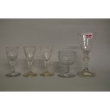 A pair of 18th century Continental faceted stem wine glasses, 12cm high, engraved with classical