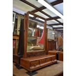 A George III mahogany toilet mirror, 47.5cm wide.