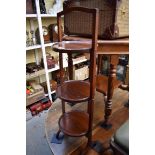 A circa 1920 mahogany folding three tier cake stand.