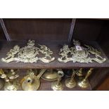 A pair of cast brass Royal Standard mounts, 28cm wide.