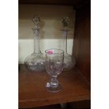 Two old glass decanters and a goblet, each etched with the flag of the White Star Line.