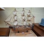 A wooden model of HMS Victory, total length 52cm.