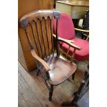 A Victorian beechwood kitchen type elbow chair.