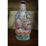 A Chinese famille rose figure of Guanyin, 19th century, 26cm high.