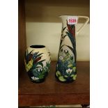 A Moorcroft 'Lamia' pattern jug, 23.5cm high; together with a matching ovoid vase, 13cm high.