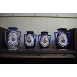 A set of four Continental porcelain Royal commemorative vases, largest 22.5cm high.