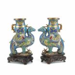 PAIR OF JAPANESE URNS, CIRCA 1920Cloisonné, wood bases. 28 x 10 x 19cm.- - -18.00 % buyer's