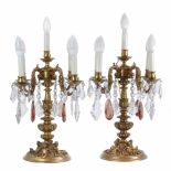 PAIR OF CANDELABRAS, C20thBronze with cristal teardrops. Electrified. Six lights. Height 58cm.- - -