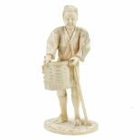 JAPANESE SCHOOL, MEIJI PERIOD C19th "OLD MAN WITH BASKET" OKIMONOCarved engraved, tinted ivory.