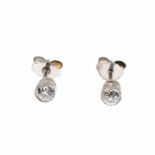 DIAMOND STUD EARRINGSWhite gold with brilliant cut diamond. Total weight 0.04ct. Clip ons. 1.