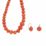 CORAL NECKLACE AND EARRINGSLong necklace of graduated coral beads & earrings. Hook clasps. Length
