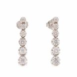 EARRINGS OFCHANNEL SET DIAMONDSWhite gold with brilliant cut diamonds, total weight approx 0-85ct.