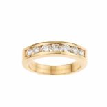 DIAMOND WEDDING RING.Yellow gold with seven brilliant cut diamonds. Total weight approx.0.70ct