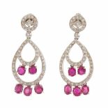 ALEN DIONE. DIAMOND AND RUBY DROP EARRINGSALEN DIONE.White gold with brilliant cut diamonds. Total