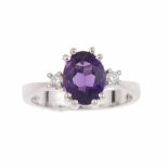 AMETHYST RINGWhite gold with 1.90ct central oval cut amethyst & two 0.10ct brilliant cut diamonds.