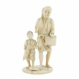 JAPANESE SCHOOL. MEIJI PERIOD, LATE C19th "PEASANT WITH CHILD" OKIMONO.Carved & tinted ivory.