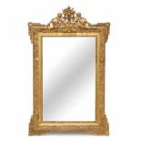 MIRROR, MID C20thGilded plaster, top decrated with cupids. 136 x 85cm.- - -18.00 % buyer's premium