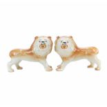 PAIR OF STAFFORDHIRE ENGLISH LIONS. END C19th -EARLY C20thCeramic. With original crystal eyes.