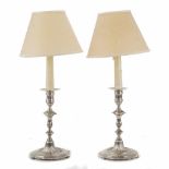 PAIR OF SILVER CANDELSTICKS, FIRST HALF C20thNot hallmaarked, Converted into lamps. 1.034kg total