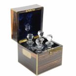 ENGLISH DECANTER BOX C20thBurr walnut and gilded brass handles. Includes four decanters and a