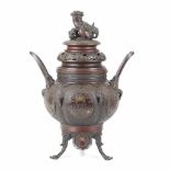 CHINESE INCENSE BURNER, C20th.Bronze fretwork, Top adorned with a Fu Lion. Height 42 cm.- - -18.00 %