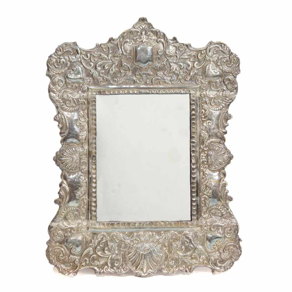 TABLE TOP MIRROR WITH SILVER FRAME, PROBABLY END C16th.Silver openwork. Subsequently added wooden