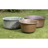 Planters/Pots: Three washing coppersincluding one with handlesthe largest 83cm diameter