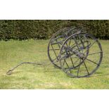 Garden Antiques: An unusual wrought iron churn cartlate 19th century154cm long