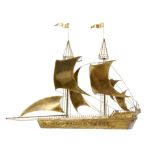 Collectibles: A half section brass galleon in the style of Curtis Jere125cm high by 160cm long