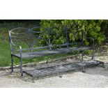 Garden Seats: ‡ A Regency style wrought iron games seat2nd half 20th centurywith hinged foot