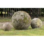 Architectural: † A set of three carved sandstone ballsmodernthe largest 70cm diameter, 43cm diameter