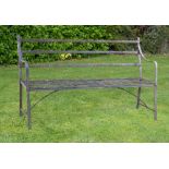 Garden Seats: A Regency reeded wrought iron seatearly 19th century154cm wide