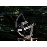 Garden Ornaments: A cast iron and copper armillary sundial1st half 20th century96cm high by 78cm