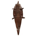 Taxidermy: A juvenile Nile crocodile skin, circa 1900, one limb detached, 215cm long